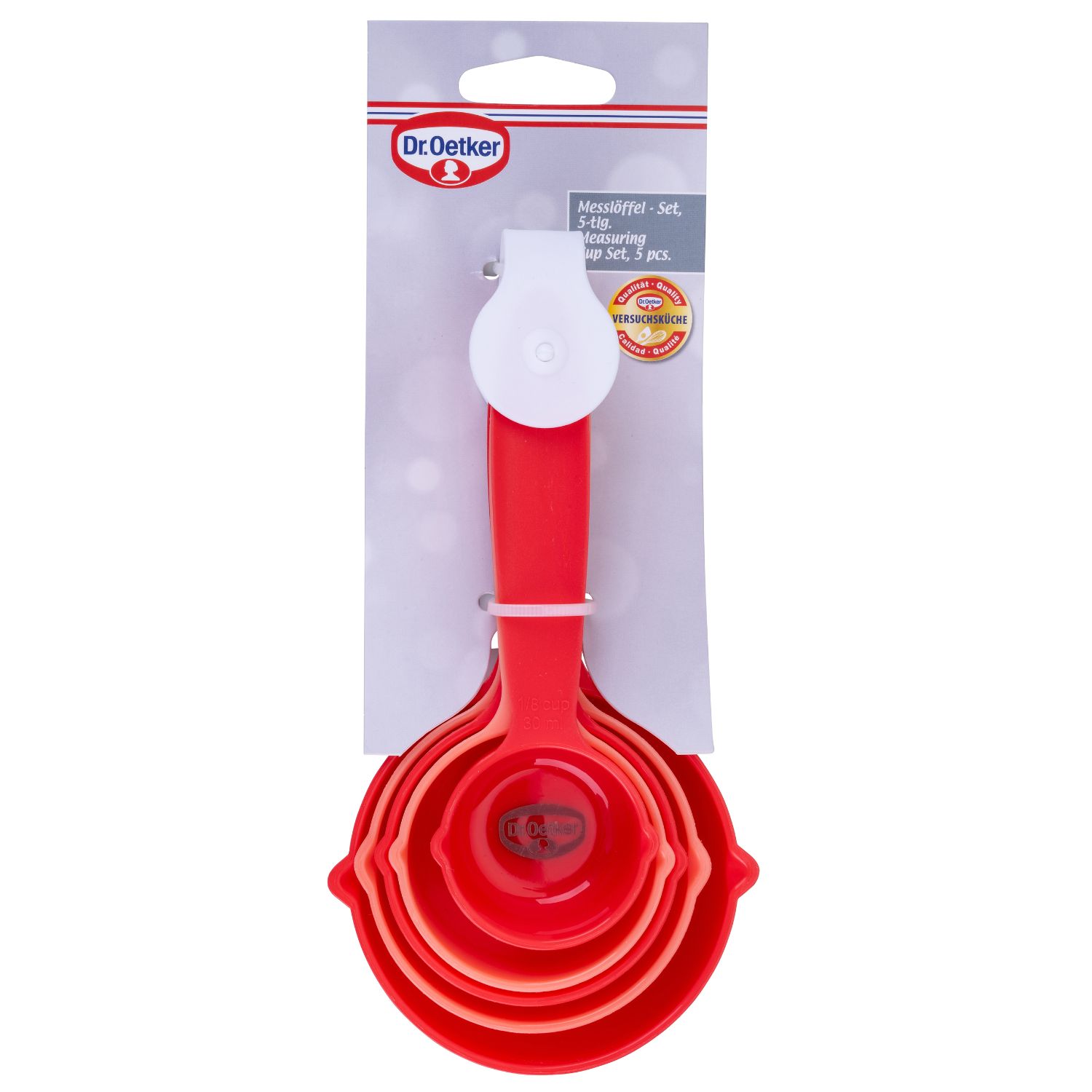 Ein 5-teiliges, rotes Messlöfffelset mit Verpackung