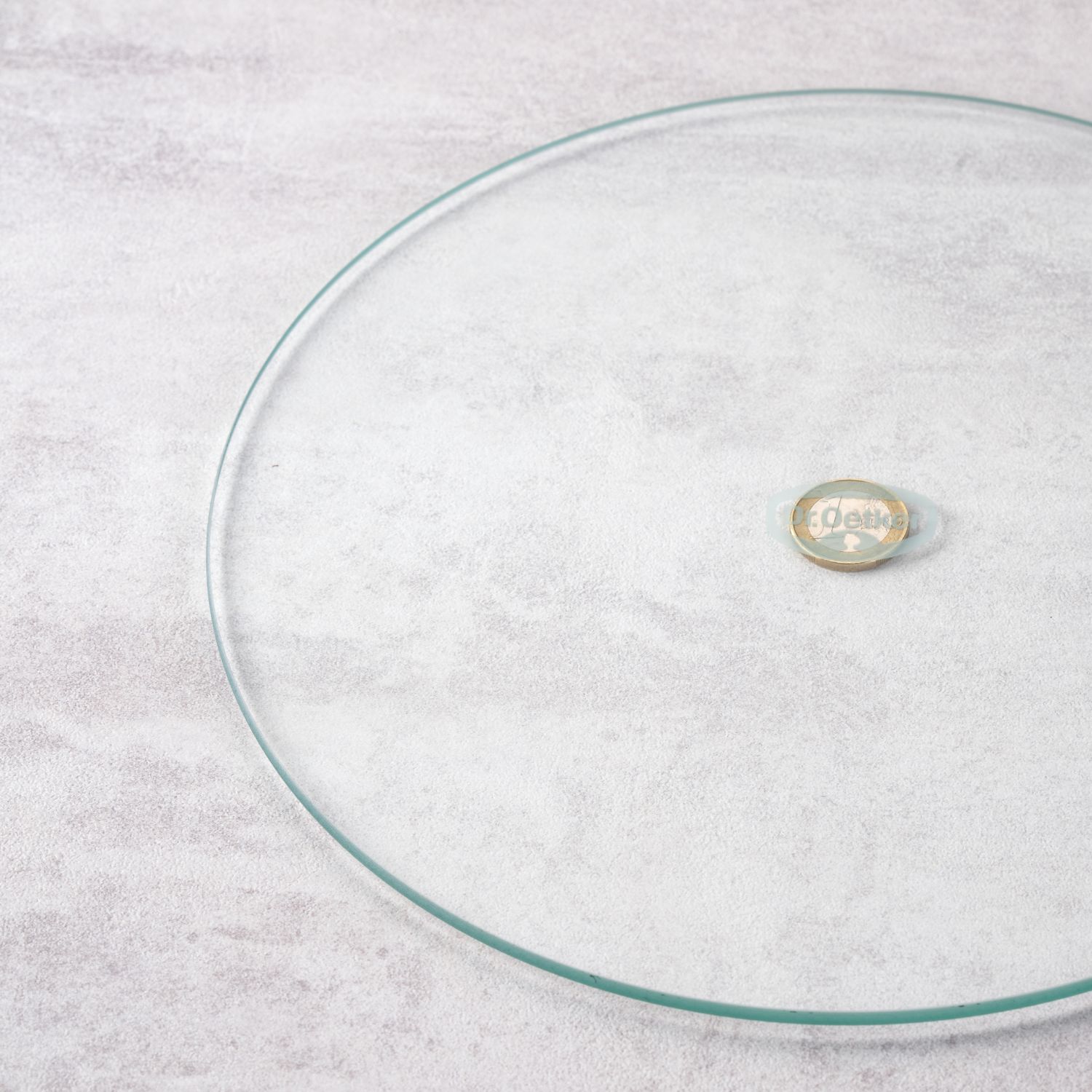 Glasboden der Springform auf einer Ein-Euro-Münze